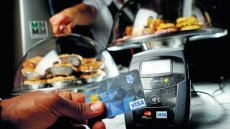 New contactless payment systems are driving more transactions through the credit card network, say retailers.